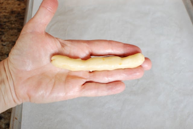 cookie batter being formed into a log