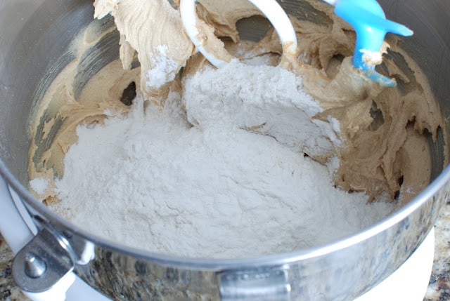 Flour mixture added to creamed peanut butter mixture in mixing bowl