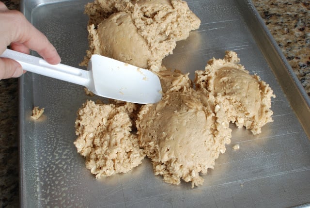 Peanut butter bar mixture spread in baking sheet