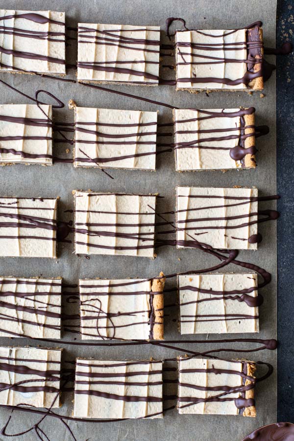 Stacked peanut butter bars drizzled with chocolate