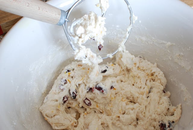 dough whisk mixing dough in bowl