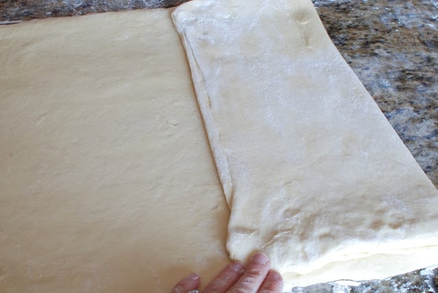 Folding dough 1/3 over top of dough