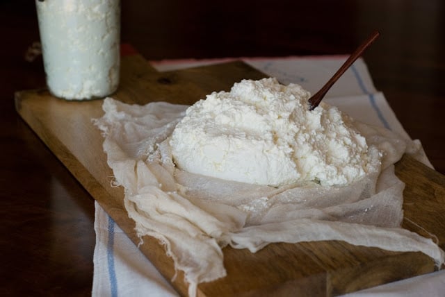 ricotta on cheese cloth on a board