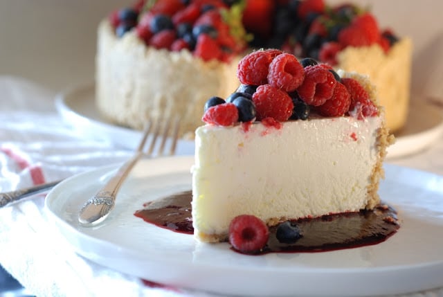 Slice of frozen lime torte topped with mixed berries