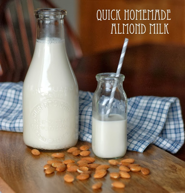 Almond milk in milk bottle with straw