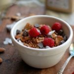 bowl of granola with fresh raspberries