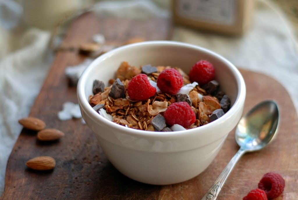 bowl of granola with fresh raspberries