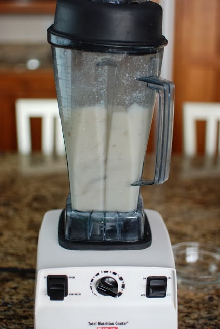 Vertical view of blending almond milk