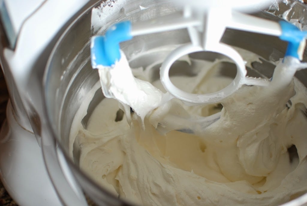 buttercream mixing in stainless bowl