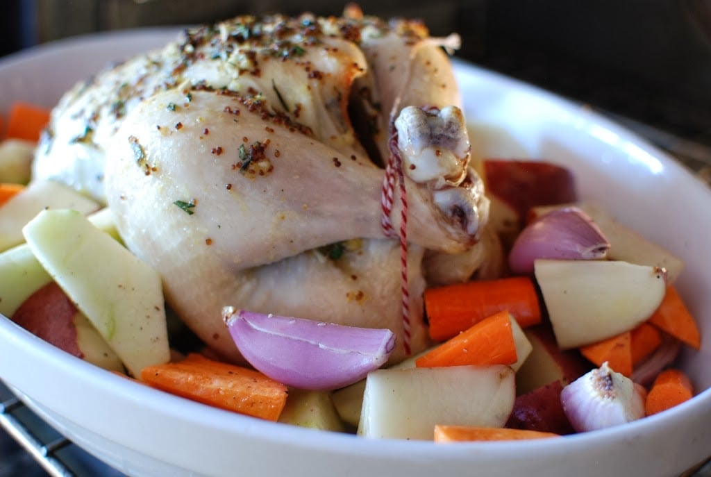 partially roast chicken with cut root vegetables