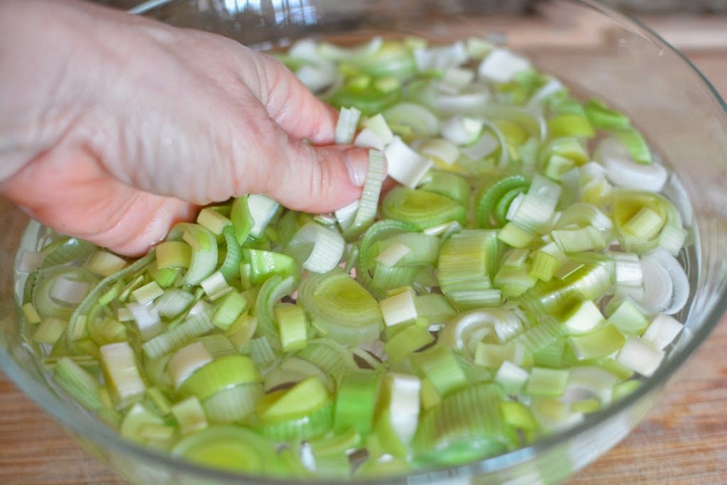 cut leeks in a bowl of water