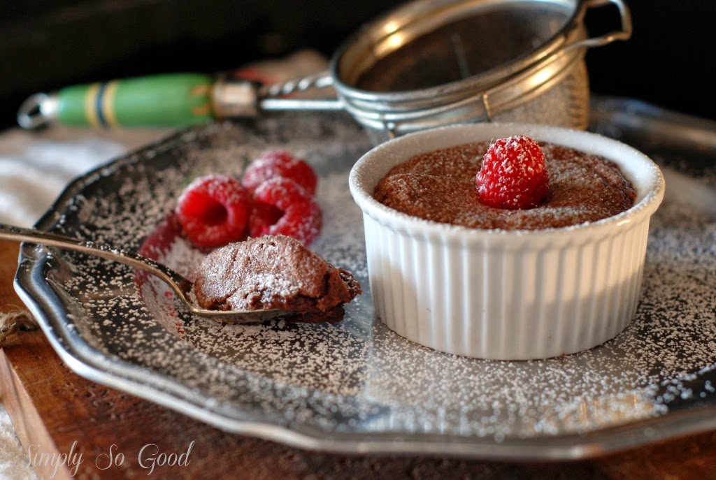 chocolate cake in ramekin and raspberries