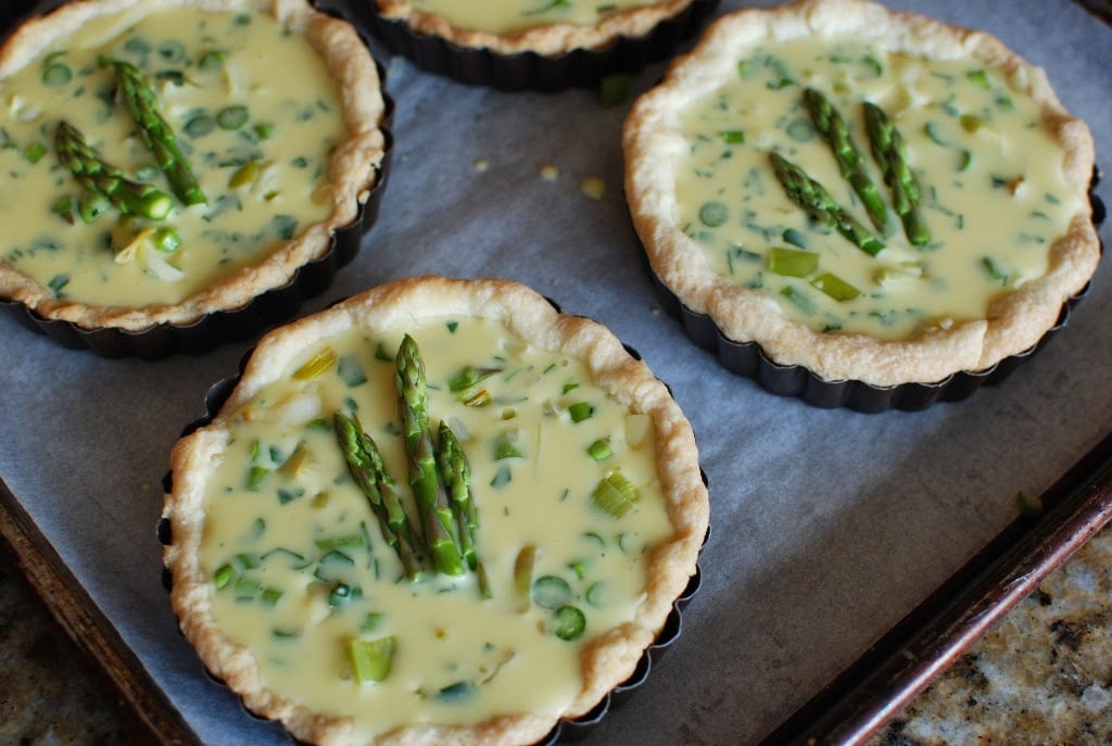 Quiche topped with asparagus tips