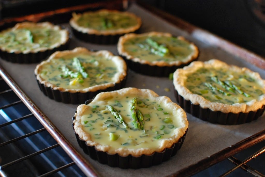 Quiche tarts going into oven