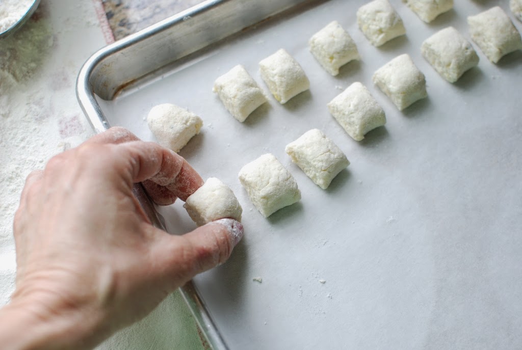 Cut gnocchi on parchment line baking sheet