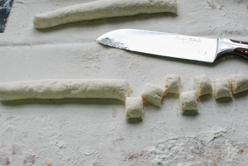 cut ricotta gnocchi on floured surface