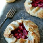 baked tarts with fork