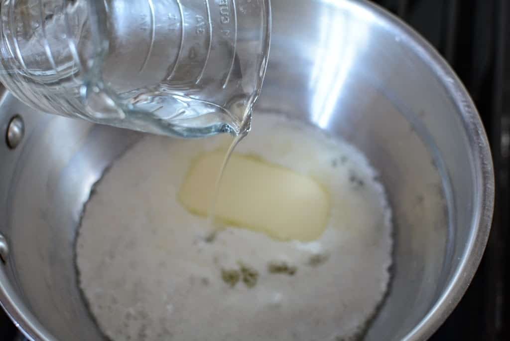 melting butter in pan with water being added