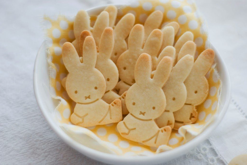 White bowl with a dozen small Miffy Petit Beurre butter bunny cookies.