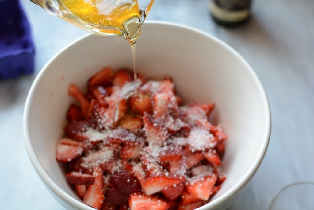 strawberries in bowl with honey