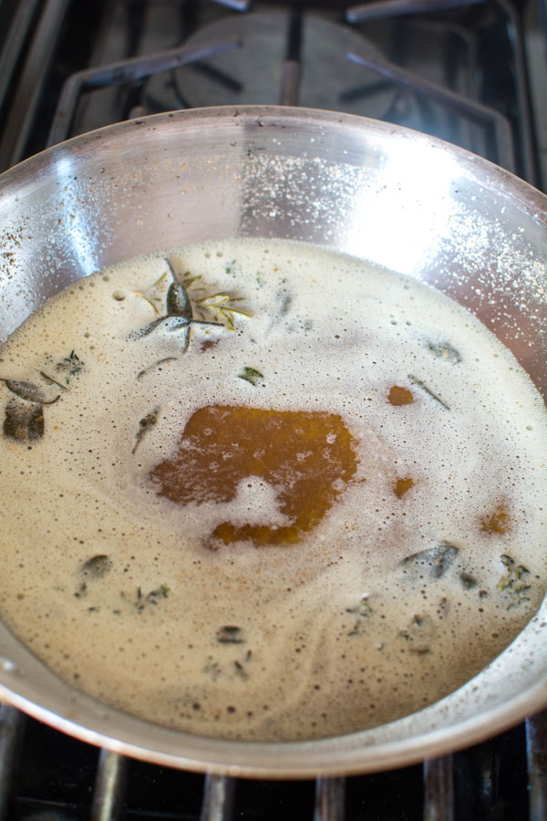 browned butter with herbs in skillet
