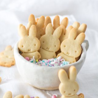Bunny butter cookies in a bowl with colored sprinkles