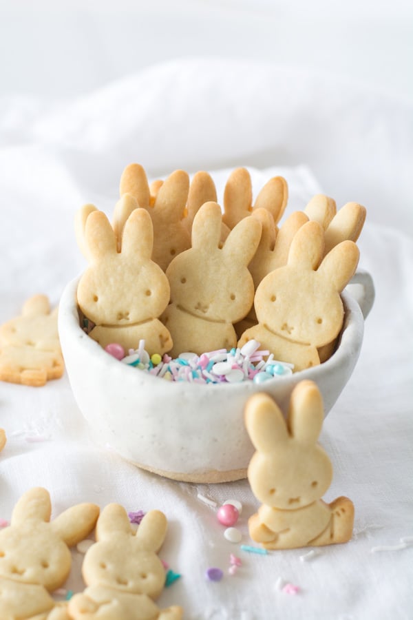 Bunny butter cookies in a bowl with colored sprinkles