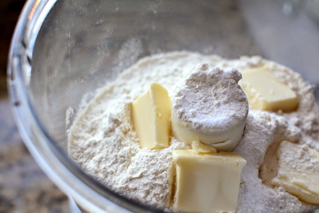 flour and butter in bowl of food processor