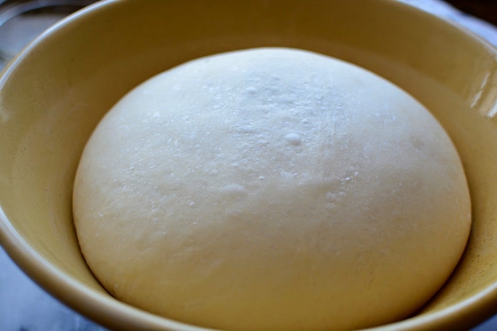 risen dough in bowl