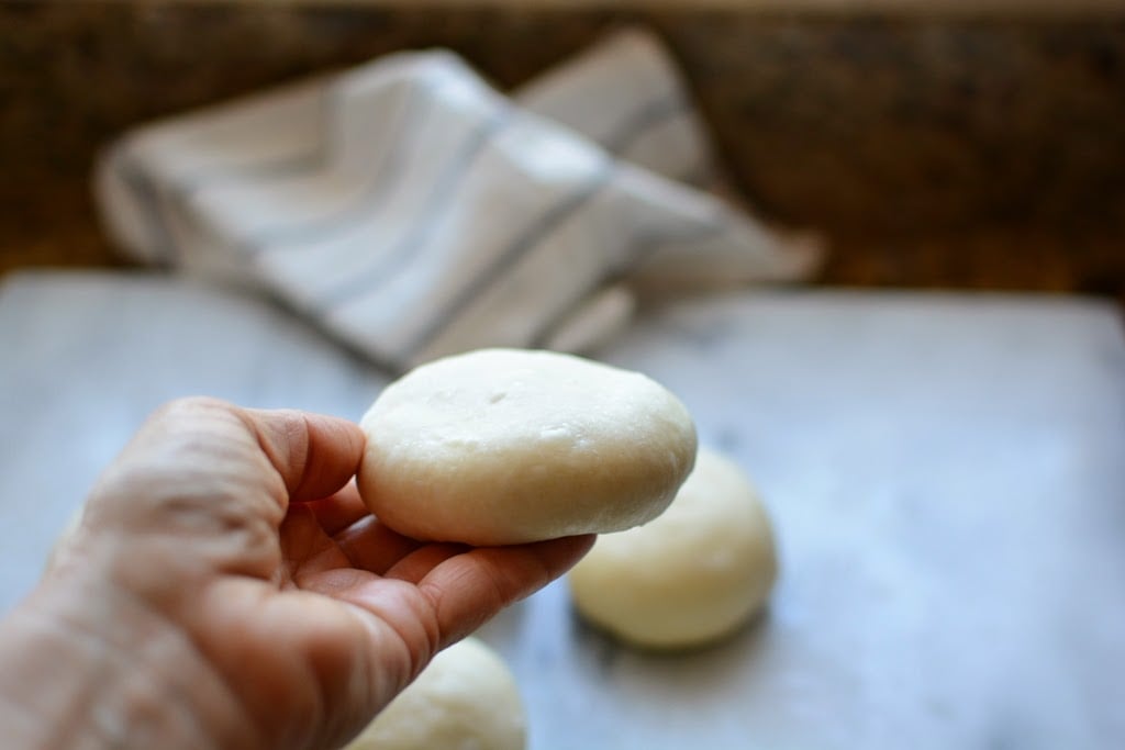 dough ball flattened to a disk