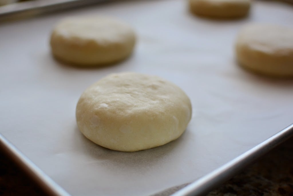 burger bun dough on baking sheet