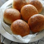 5 brioche buns on a silver platter
