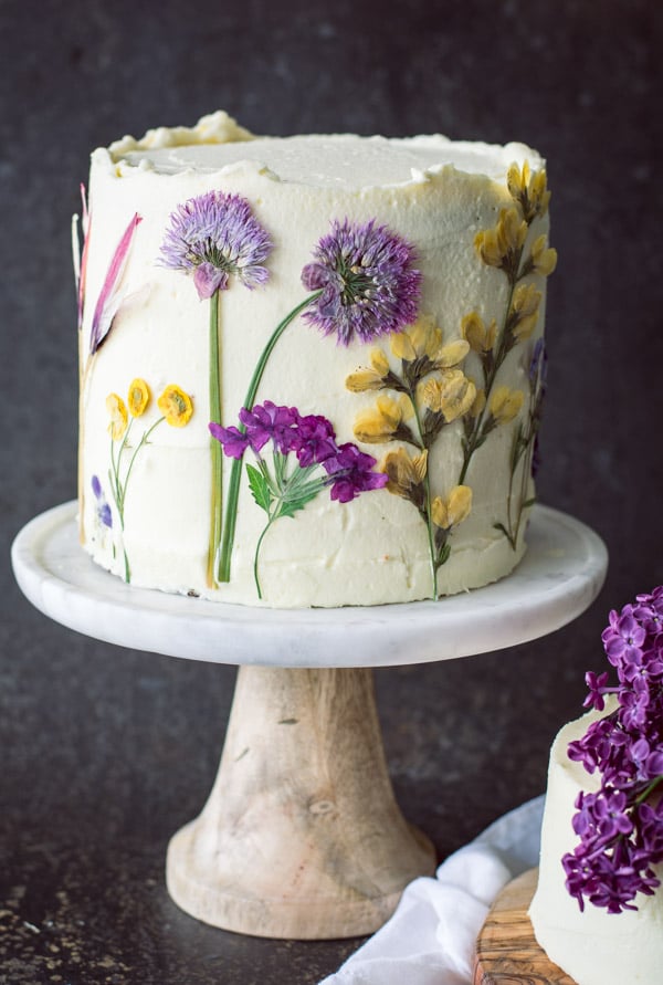 Decorated pressed flowers lemon olive oil cake.