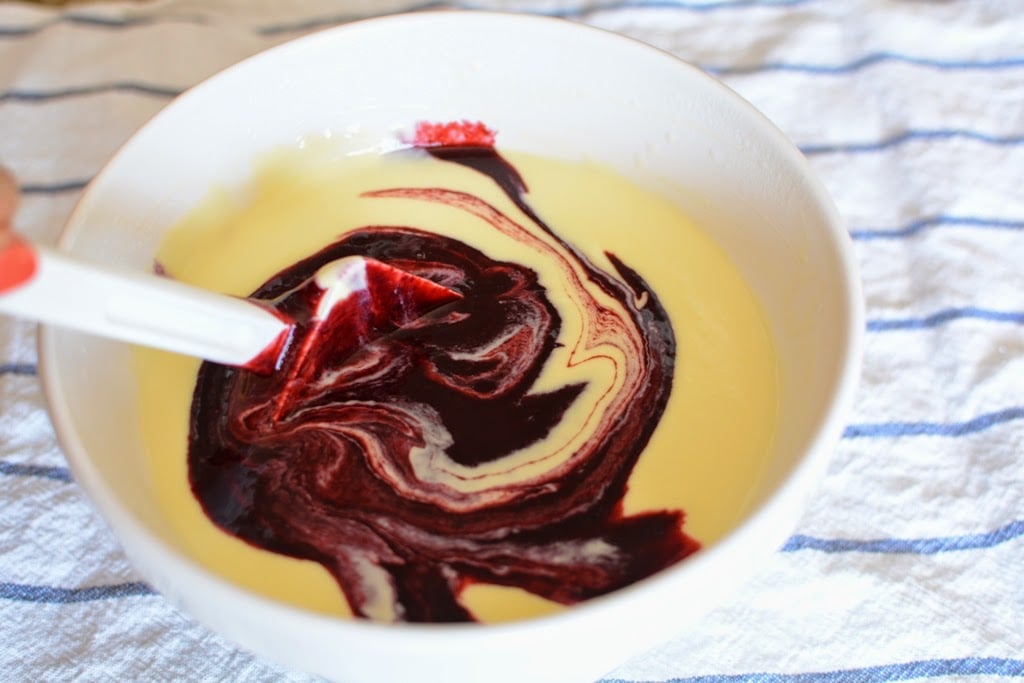 Blackberry puree swirled into ice cream base