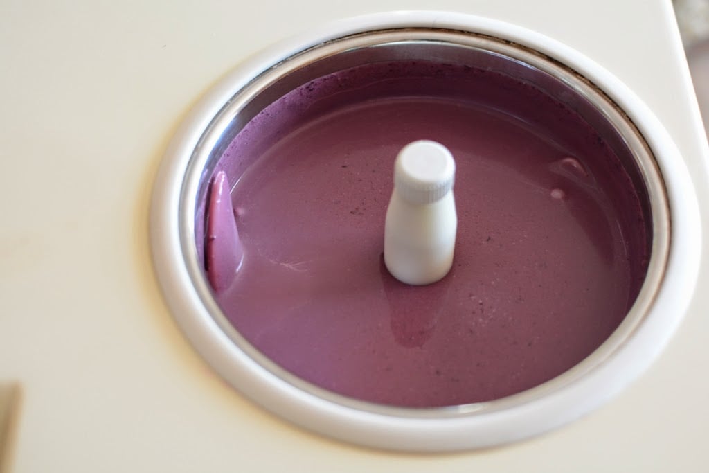 Blackberry ice cream base poured into ice cream maker