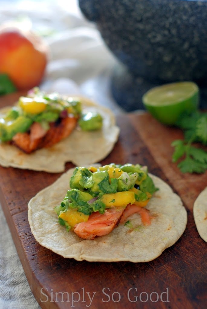 salmon tacos on wooden board