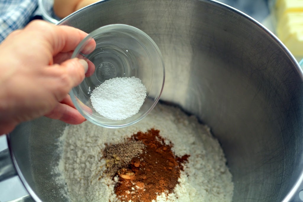 pumpkin spices added to flour in mixing bowl