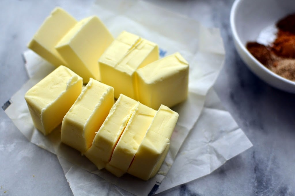 Two cubes of butter cut into chunks