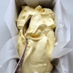 Lemon Curd Ice Cream in bread pan with spoon