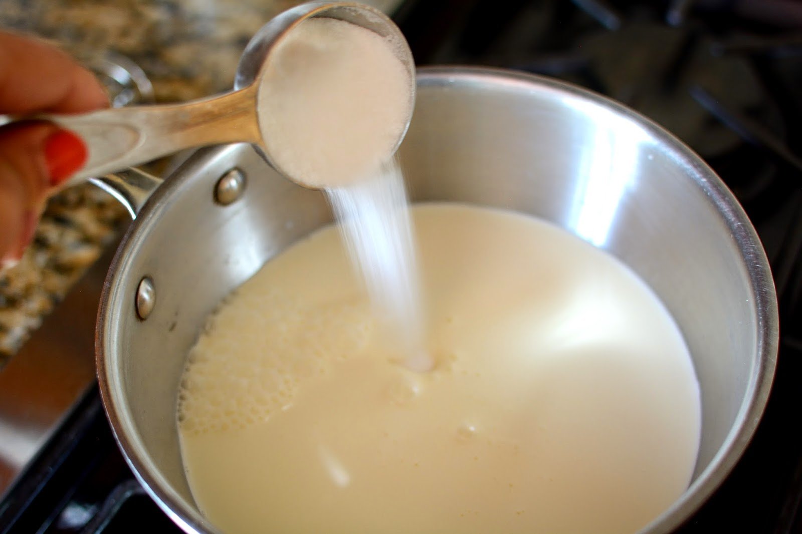 Add sugar to milk in a metal nbowl.