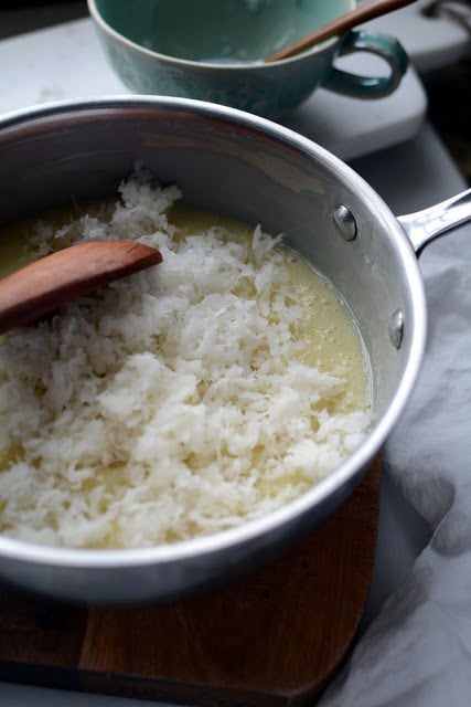 White chocolate sour cream mixture with shredded coconut.