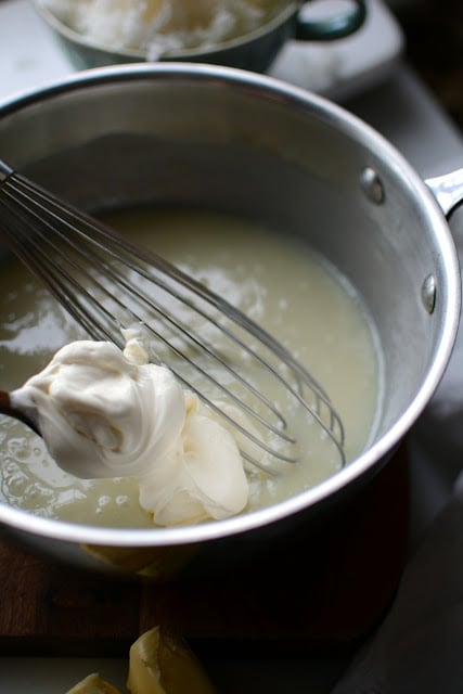 Coconut milk, white chocolate chip mixture with sour cream whisked in.