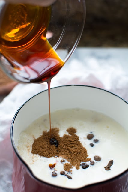 Molasses pouring into milk and spices