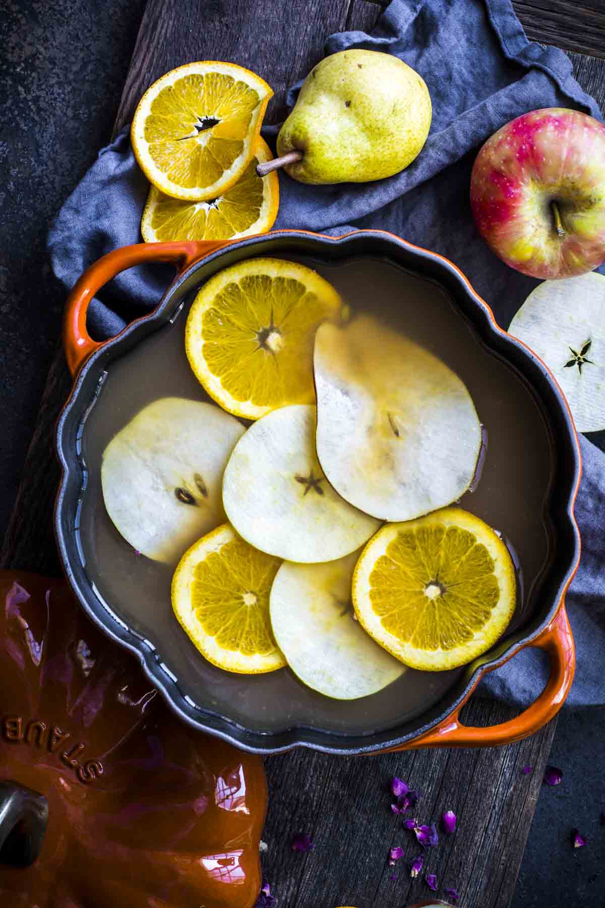 Apple Pear Rose Cardamom Cider in a pumpkin shaped pot