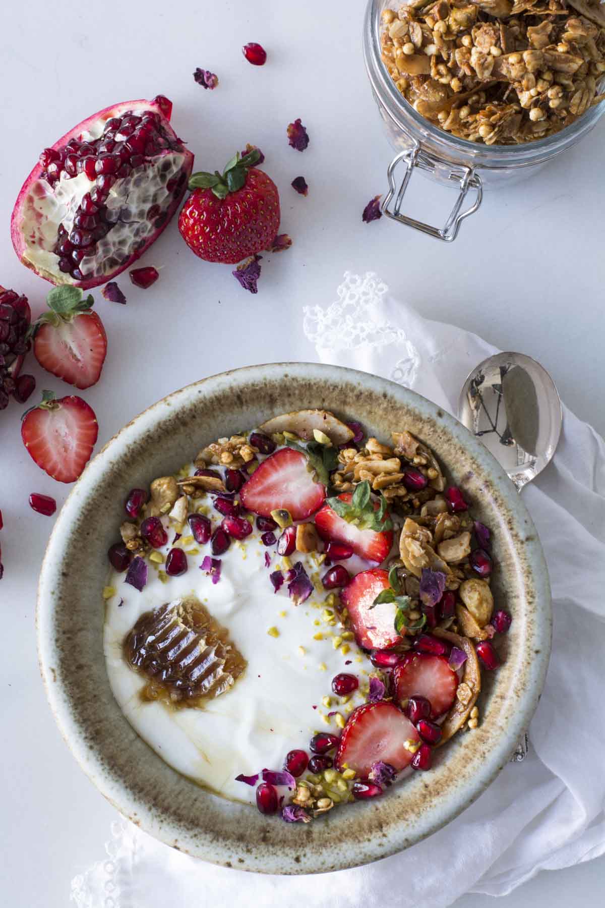 yogurt topped with granola and berries