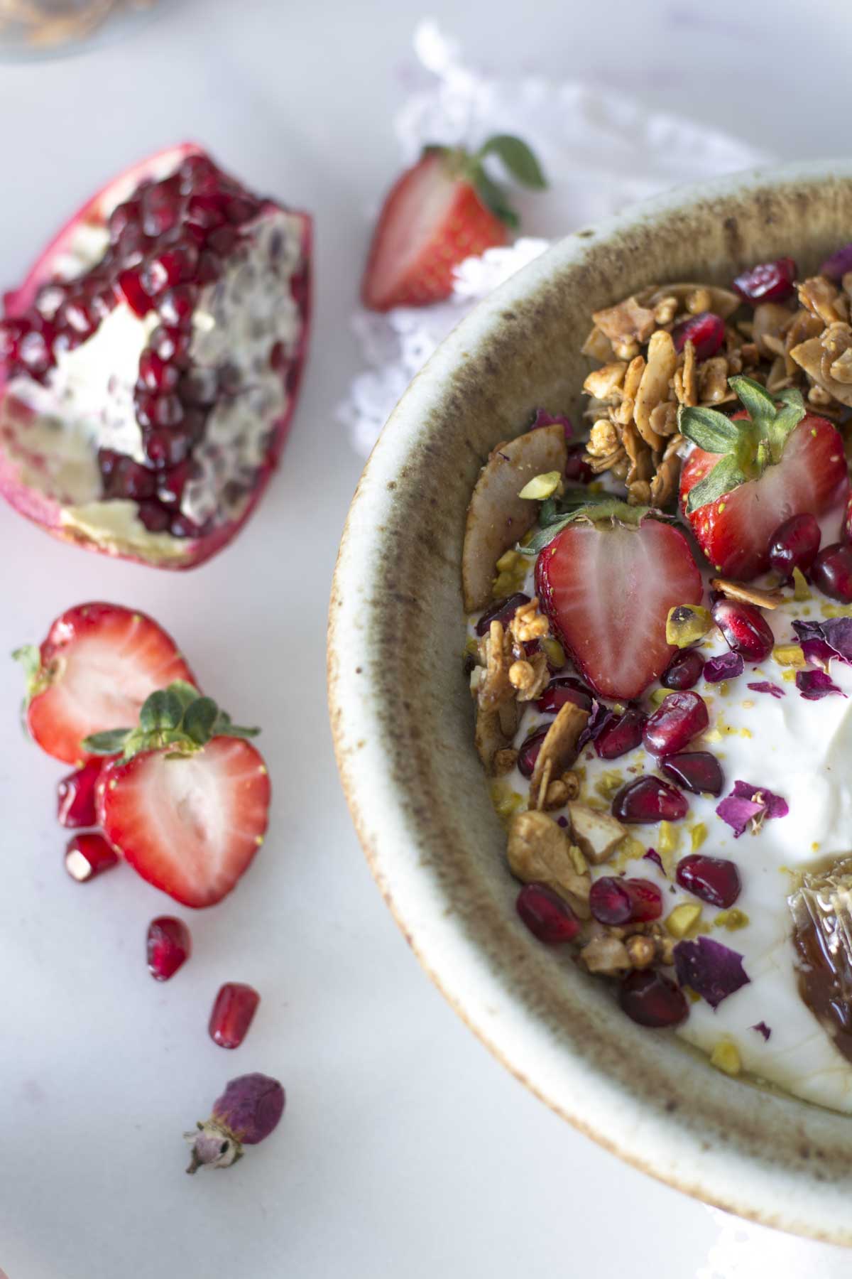 yogurt bowl with strawberries, pomegranates