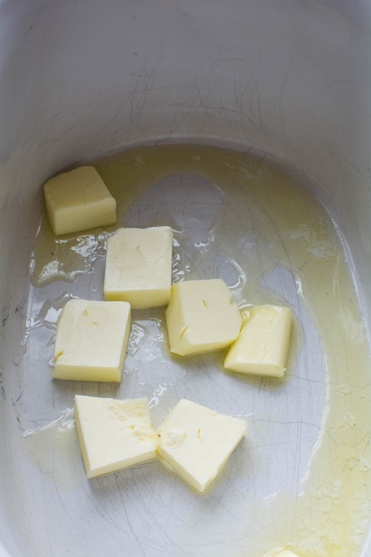 Butter chunks in crock pot insert for french onion soup