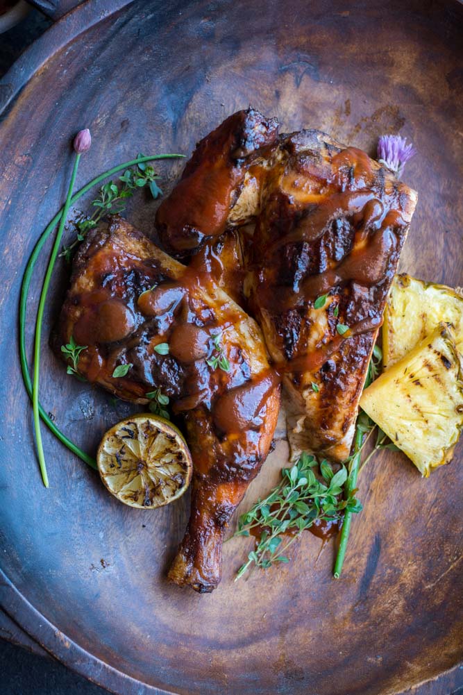 Chicken on wood bowl with pineapple slices