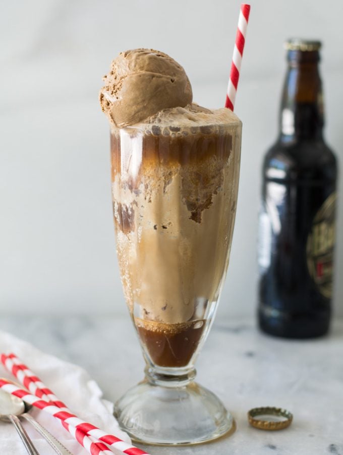 ultimate double root beer in tall glass with red striped strawfloat