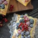 Easy Fresh Berry Puff Pastry Tarts on a cooling rack with white cloth